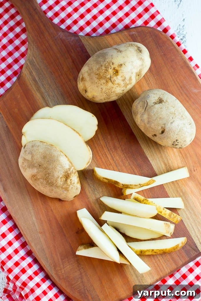 Perfectly Crisped Oven Fries 3 showing how to cut the perfect sized French fries from your potatoes
