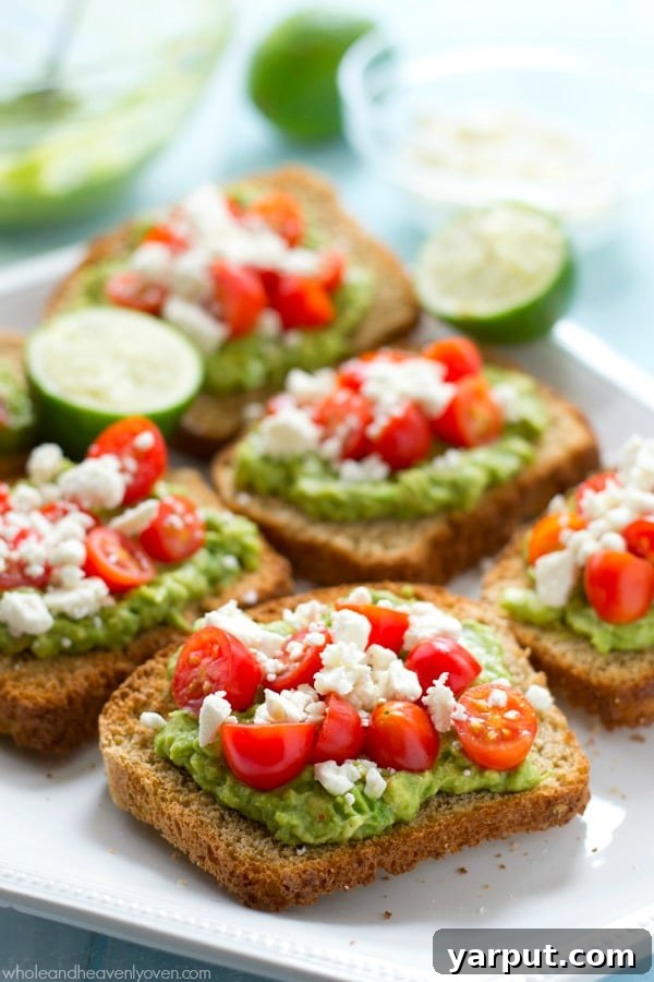 Savor Summer: 13 Vegetarian Avocado Delights 4 Fresh Greek Avocado Toast topped with cherry tomatoes and herbs