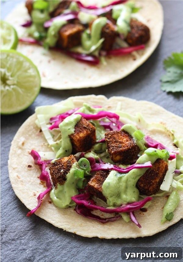 Savor Summer: 13 Vegetarian Avocado Delights 6 Crispy Blackened Tofu Tacos generously drizzled with avocado lime crema