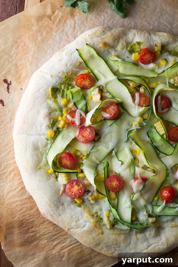 Savor Summer: 13 Vegetarian Avocado Delights 8 Fresh Guacamole Pizza topped with sweet corn and tender zucchini