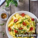 Creamy Corn Penne with Basil & Cherry Tomatoes: A vibrant serving, ready to enjoy.