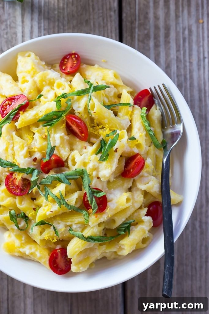 Creamy Vegan Corn Penne with Sweet Basil and Juicy Cherry Tomatoes 7 Creamy Corn Penne with Basil & Cherry Tomatoes: A prepared bowl of the delicious pasta.