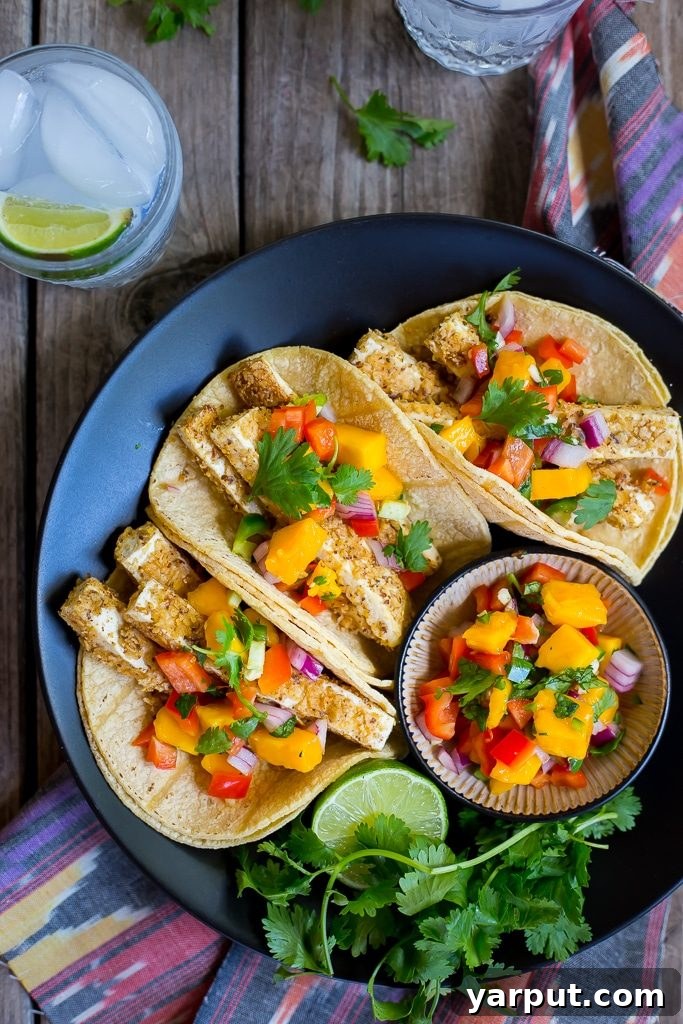 Golden Crunch Tofu Tacos with Sunny Mango Salsa 2 Crispy Tortilla Chip Crusted Tofu Tacos with vibrant Mango Salsa – a healthy, vegan, and gluten-free delight perfect for your next taco night.