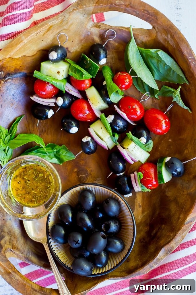Sun-Kissed Chèvre Stuffed Olive Skewers 2 Goat Cheese Stuffed Black Olive Mediterranean Kabobs, ready to serve as an appetizer