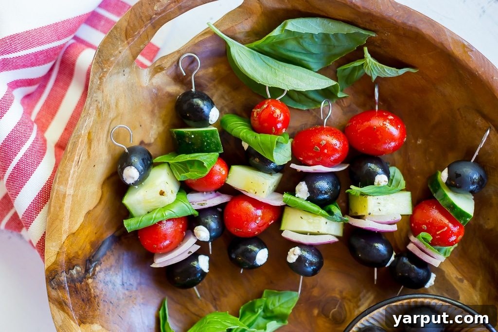 Sun-Kissed Chèvre Stuffed Olive Skewers 4 Close-up of a Goat Cheese Stuffed Black Olive Mediterranean Kabob on a plate