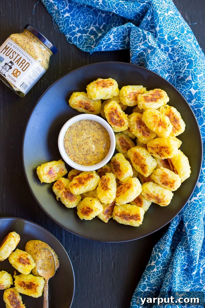 Golden Spaghetti Squash Tots with Tangy Maple Mustard 7 Homemade healthy tater tots made with spaghetti squash served on a plate