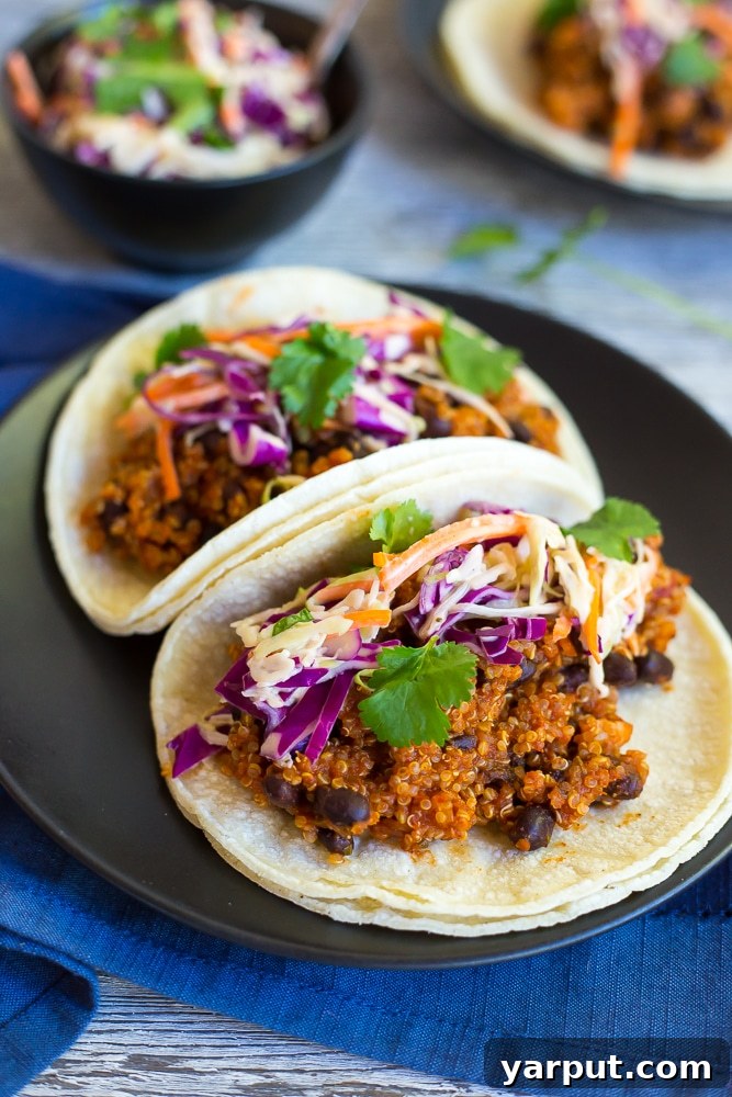 Smoky Vegan Black Bean Quinoa Tacos with Fresh Cilantro Slaw 6 Stacked BBQ Black Bean & Quinoa Tacos with fresh cilantro, ready to be enjoyed.