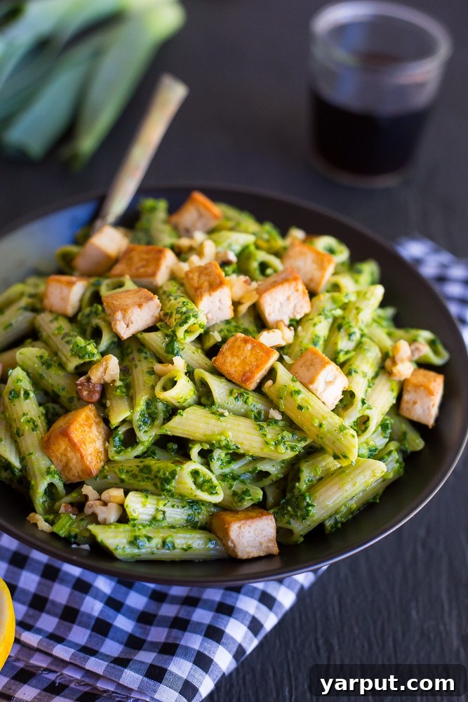 Ingredients for Kale and Leek Pesto Pasta on a cutting board