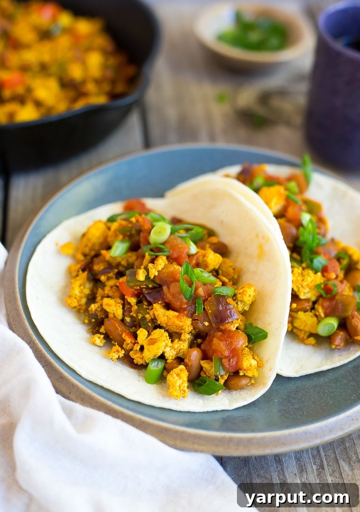 Zesty Southwest Tofu Breakfast Tacos 5 A close-up shot of vibrant Southwest Tofu Scramble Breakfast Tacos, bursting with color and flavor.