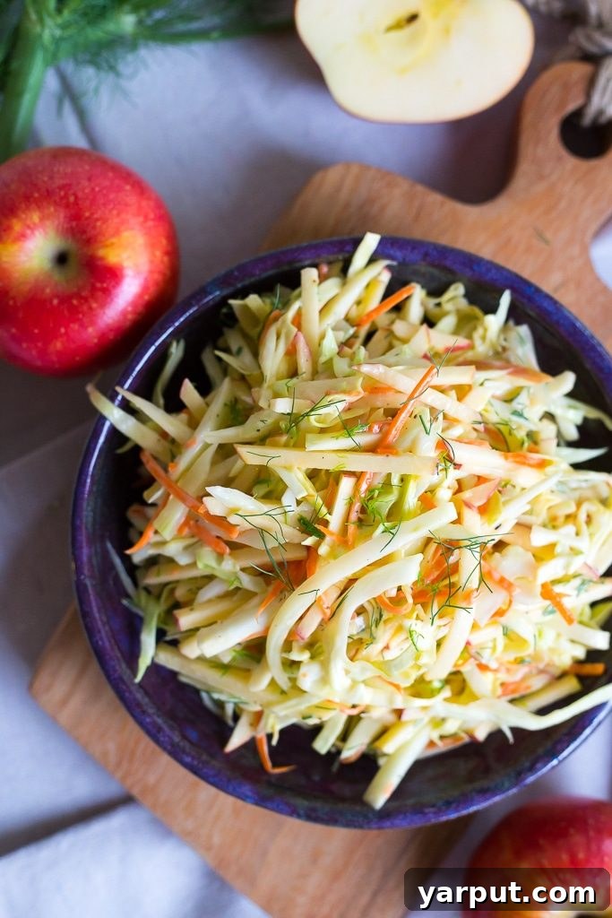 Fennel and Apple Slaw served in a white bowl, ready to be enjoyed