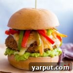 Black Bean Fajita Veggie Burger with pepper jack, peppers, onions, and guacamole