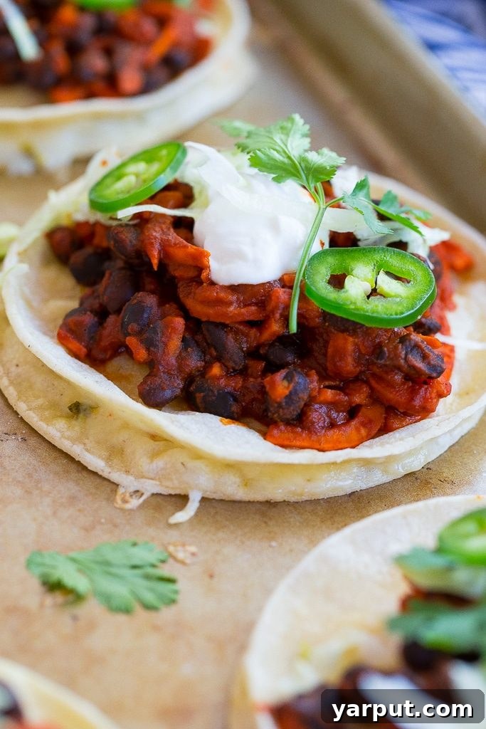 Speedy Spiralized Sweet Potato Enchilada Bowls with Black Beans 5 An assembled Inside-Out Enchilada with fresh toppings like cilantro and Greek yogurt.