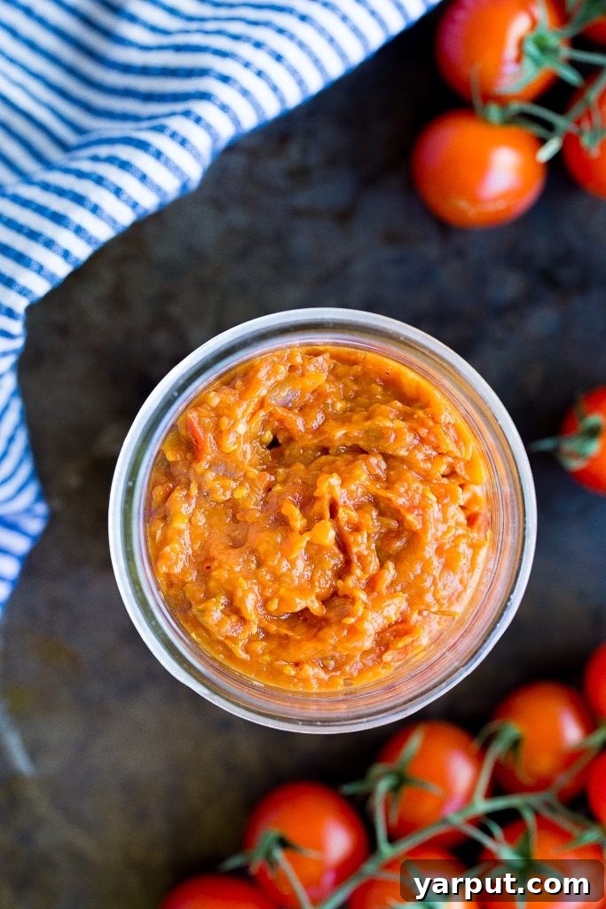 Effortless Cherry Tomato Preserve 2 A jar of freshly made Easy Cherry Tomato Jam, ready to be spread. This homemade condiment is gluten-free and vegan, perfect for summer dishes.