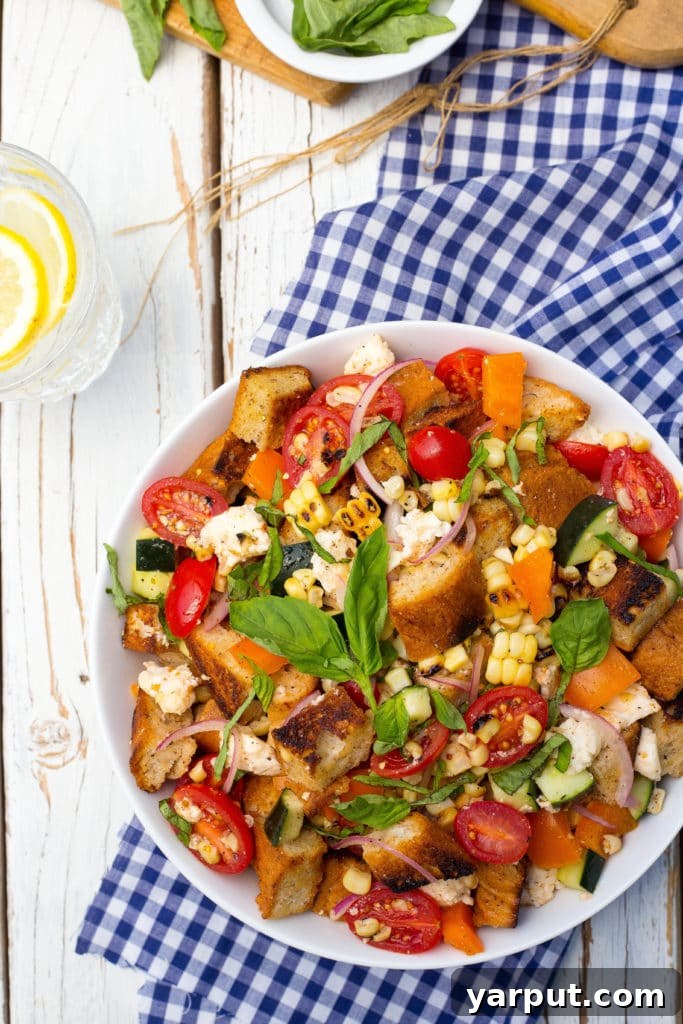Vibrant Summer Panzanella with Charred Corn 2 Grilled Corn Summer Panzanella Salad! You will get a delicious taste of summer in every bite! This is the perfect side dish for a BBQ or light lunch!