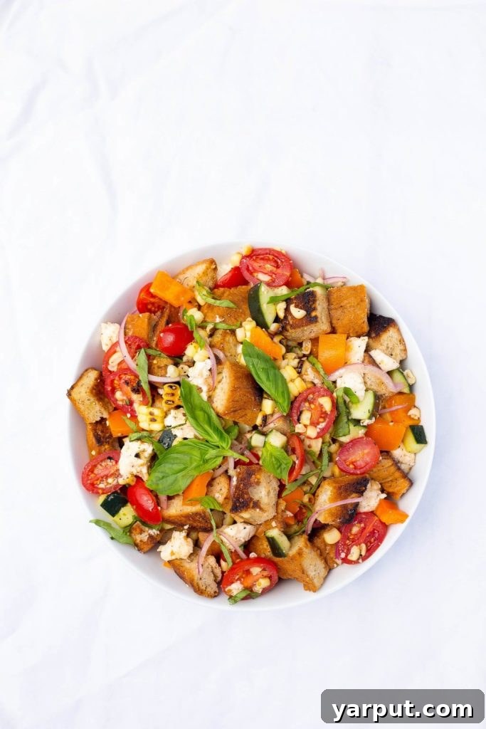 Vibrant Summer Panzanella with Charred Corn 3 Grilled Corn Summer Panzanella Salad! You will get a delicious taste of summer in every bite! This is the perfect side dish for a BBQ or light lunch!