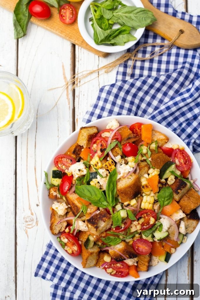 Vibrant Summer Panzanella with Charred Corn 4 Grilled Corn Summer Panzanella Salad! You will get a delicious taste of summer in every bite! This is the perfect side dish for a BBQ or light lunch!