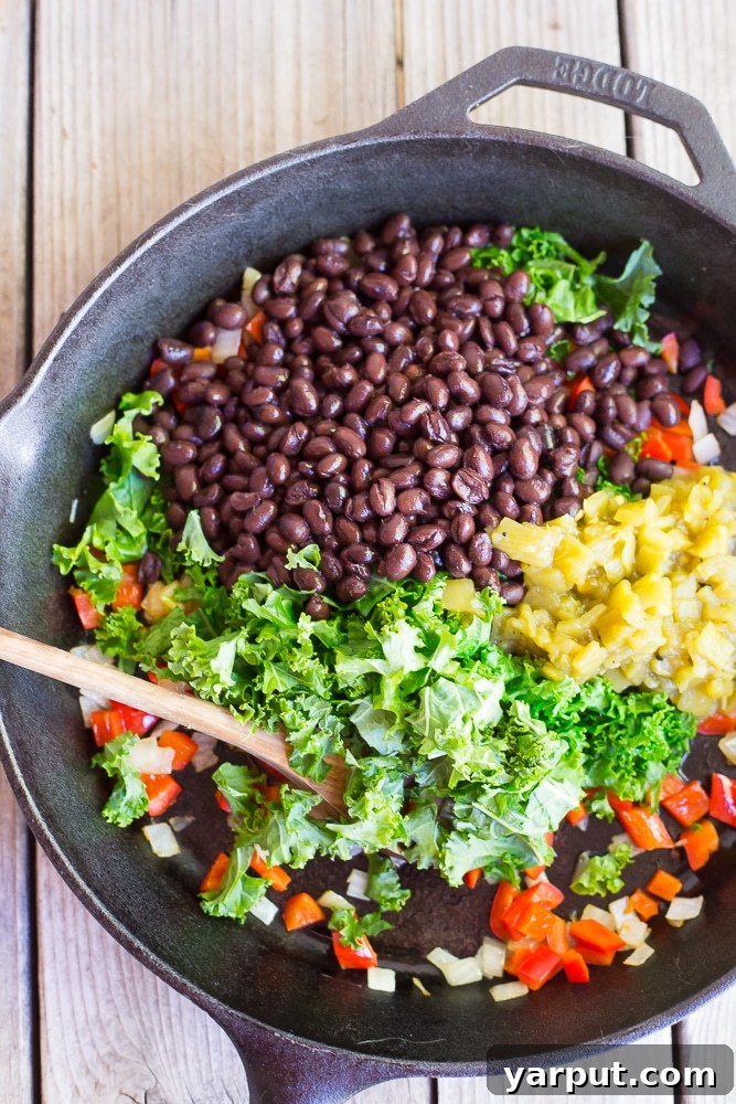 One-Pot Vegan Cheesy Tacos 4 Fresh ingredients for Cheezy Vegan Taco Skillet including kale, bell peppers, black beans, corn tortillas, and spices