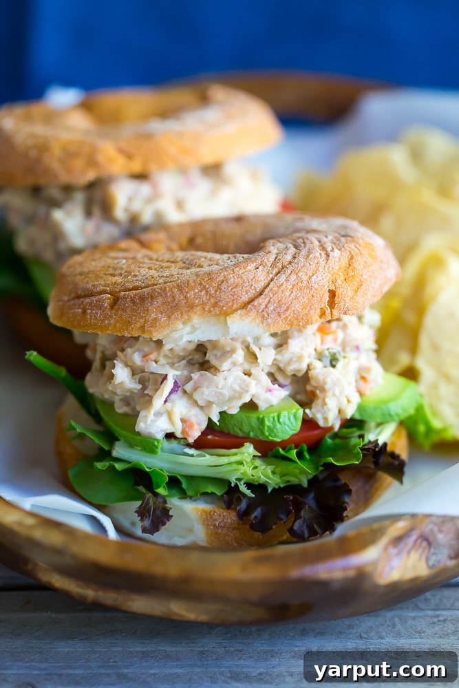 Quick & Hearty Chickpea and White Bean Sandwich Filling 6 A stack of two vegan chickpea and white bean salad sandwiches, showing the wholesome filling and bread.