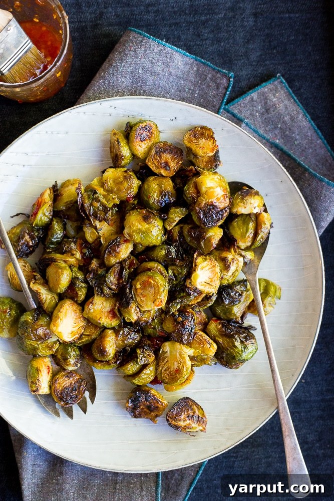 Sweet Heat Roasted Brussels Sprouts 2 Sweet Chili Roasted Brussels Sprouts, perfectly caramelized and glazed, ready to be served as a delicious side dish or appetizer. Vegan and gluten-free.