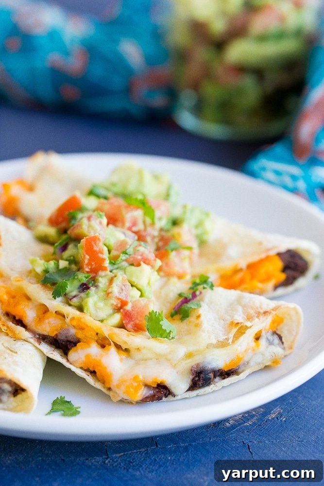 Golden Baked Sweet Potato and Black Bean Tacos 2 Crispy Baked Black Bean & Sweet Potato Tacos - A quick, easy, and healthy vegetarian dinner recipe with vibrant Mexican flavors, ready in just 30 minutes!