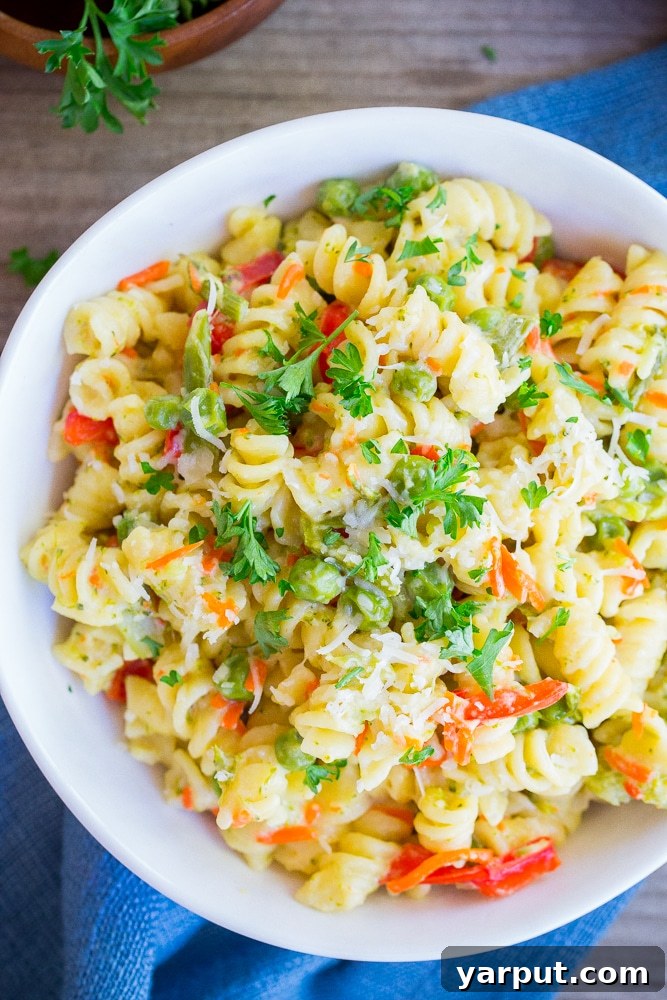 Quick One-Pot Primavera Pasta 5 Overhead shot of freshly cooked One-Pot Pasta Primavera in a large pot, ready to be served, emphasizing its simplicity and appeal as a wholesome vegetarian meal.