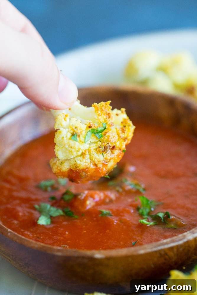 Cauliflower Pizza Poppers 3 Deliciously seasoned Baked Cauliflower Pizza Bites, a healthy, vegan, and gluten-free alternative to traditional pizza snacks.