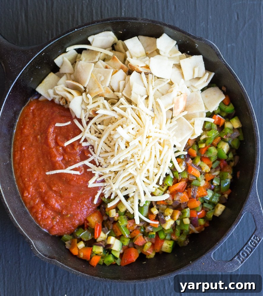 One Pan 30 Minute Pizza Meal 3 Close-up of bubbling 30-Minute Pizza Skillet Casserole, perfect for a quick and easy vegetarian weeknight meal.