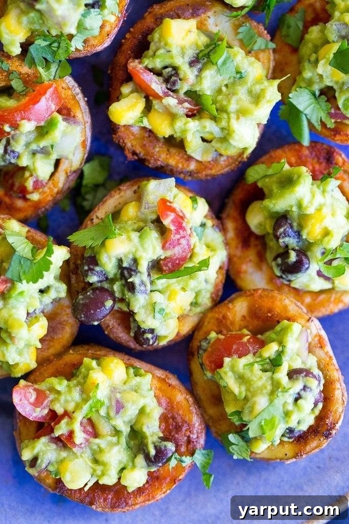 Guilt-Free Mexican Delights 17 Appetizing Roasted Potato Cups generously filled with Loaded Guacamole.