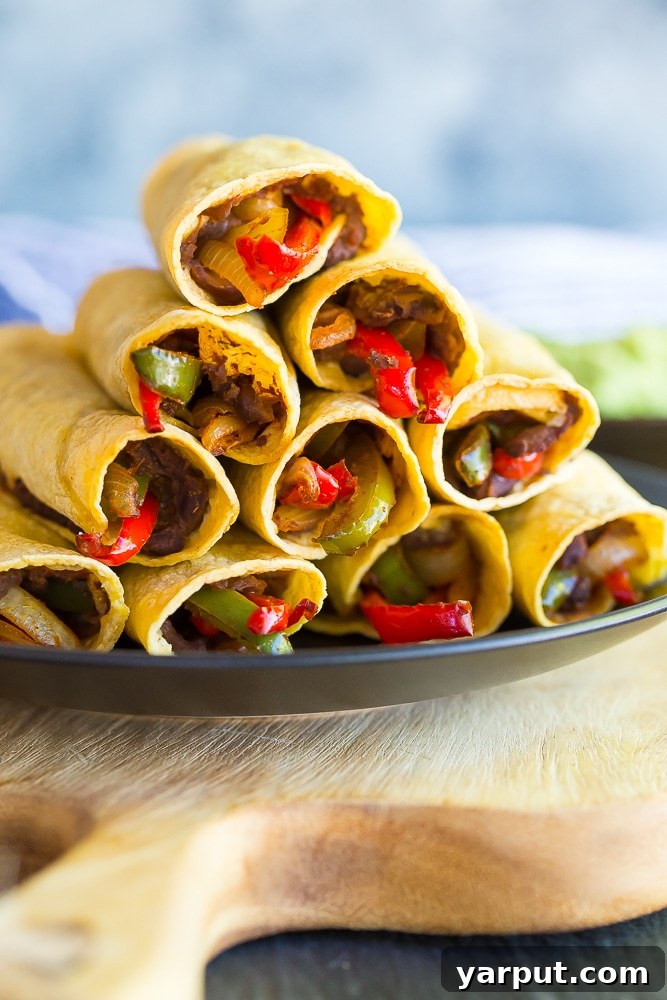 Guilt-Free Mexican Delights 4 Crispy Baked Fajita Taquitos, filled with flavorful fajita vegetables and a healthy twist.
