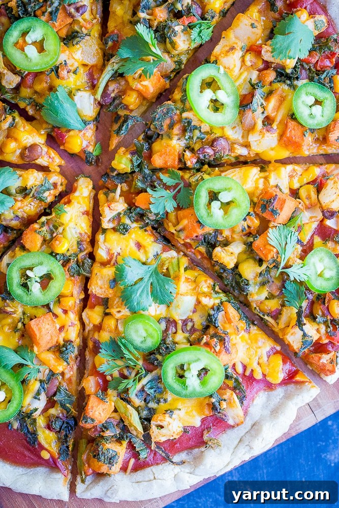 Southwest Fiesta Pizza 2 Delicious Southwest Veggie Taco Pizza piled high with colorful vegetables and melted cheese, perfect for a healthy and quick vegetarian dinner.