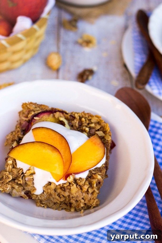 Ginger Peach Baked Oatmeal with Whipped Coconut Cream - comforting, healthy, and easy to prepare ahead.