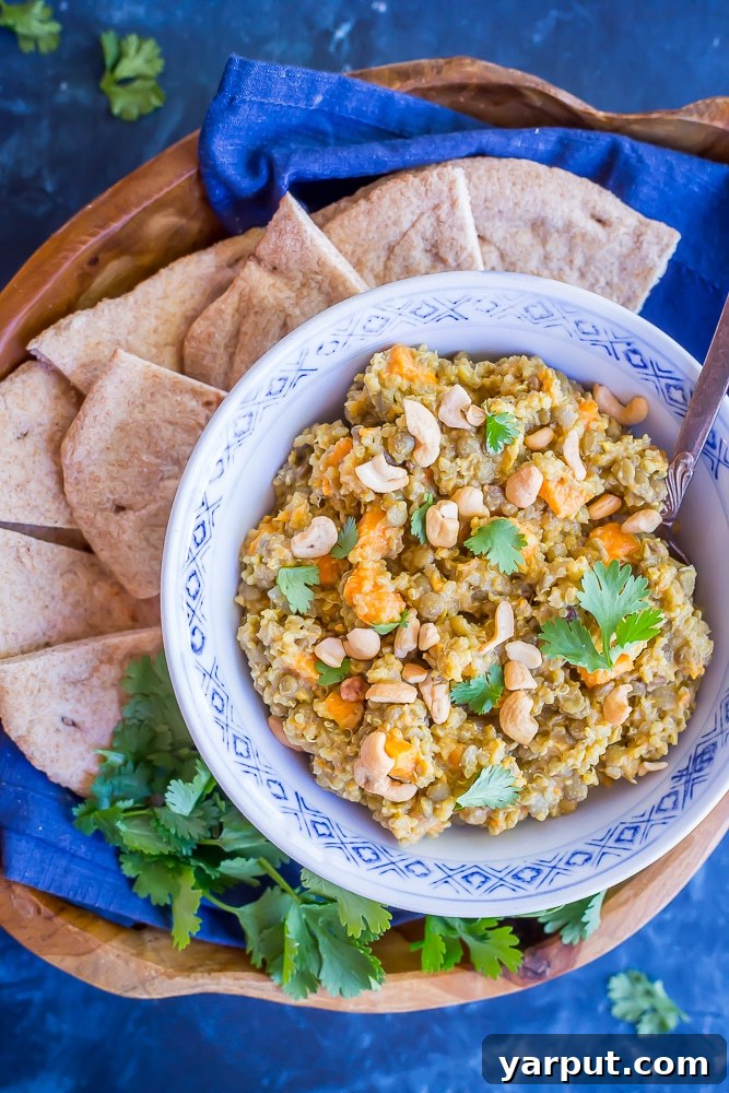 Wholesome One-Pot Coconut Curry with Quinoa, Lentils, and Sweet Potatoes 2 Rich and creamy One-Pot Coconut Curry with Quinoa, Lentils, and Sweet Potatoes, garnished with fresh cilantro, a perfect vegan dinner.