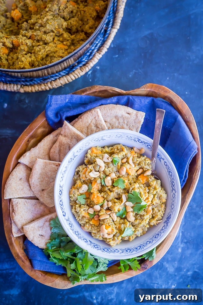 Wholesome One-Pot Coconut Curry with Quinoa, Lentils, and Sweet Potatoes 4 A large pot filled with the One-Pot Coconut Curry simmering on the stovetop, showing the rich texture and vibrant colors before serving.