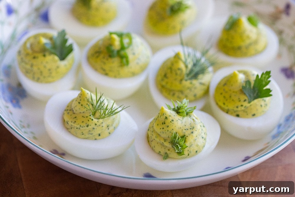 Herbal Ambrosia Deviled Eggs 7 A vibrant platter of spring herb deviled eggs, artfully arranged and garnished, ready to be served at a festive gathering or Easter celebration.