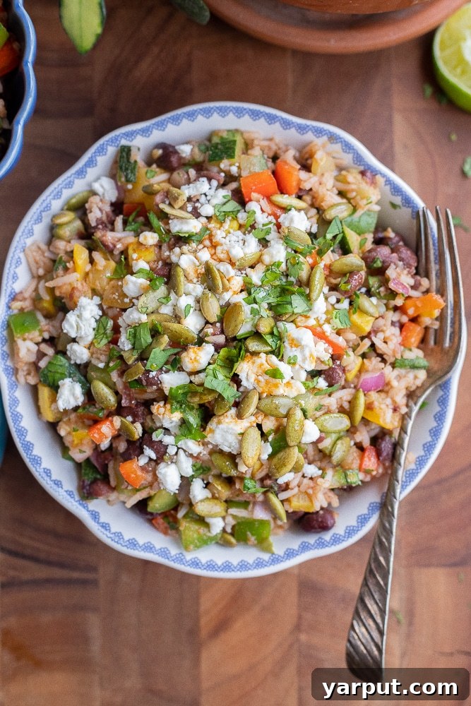 serving bowl full of black bean and rice salad with vegetable