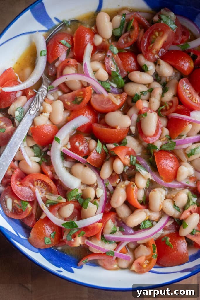 Cherry Tomato and White Bean Salad with Basil Vinaigrette 6 close up of a bowl of cherry tomato and white bean salad