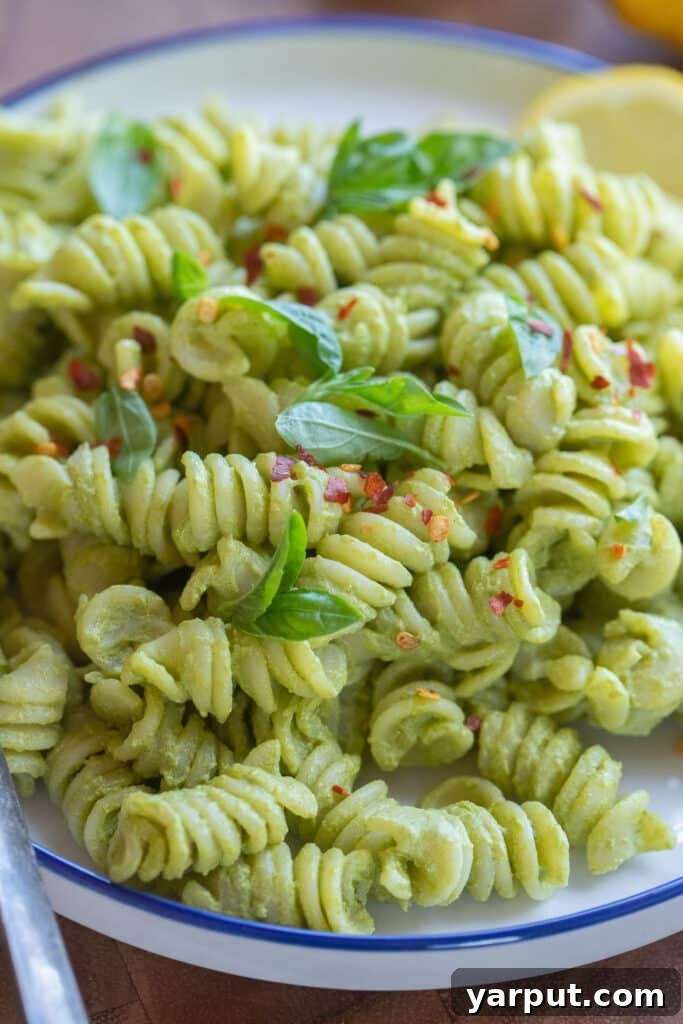 Close up of a plate full of creamy lemon basil pasta