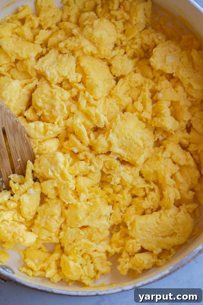 fluffy scrambled eggs in a pan