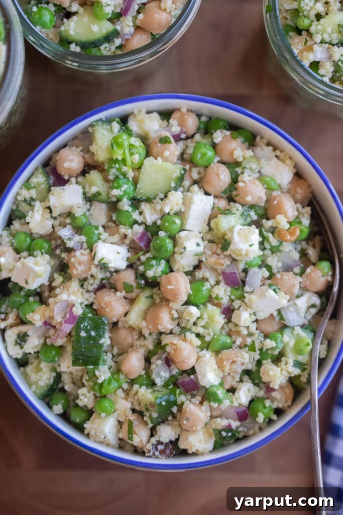 Close up of a bowl of protein packed sweet pea couscous salad