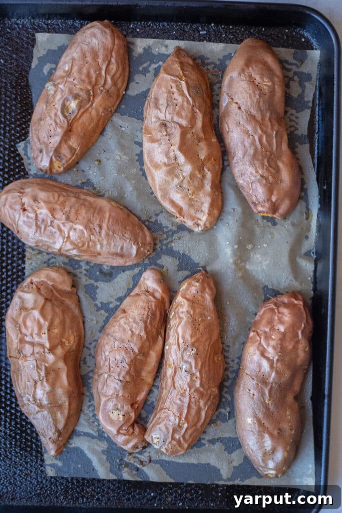 roasted sweet potatoes on a sheet pan