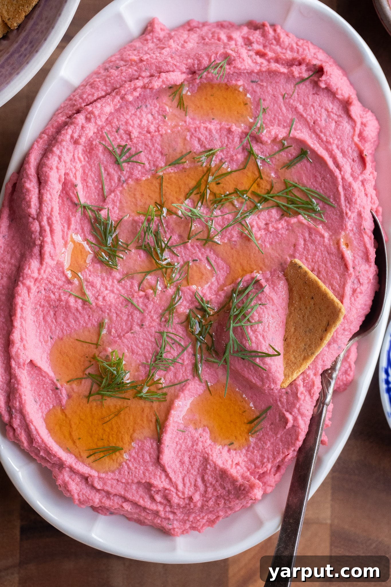 Pickled Beet Hummus Recipe: A Vibrant Twist on Classic 6 close up of a platter of pickled beetroot hummus topped with olive oil and dill